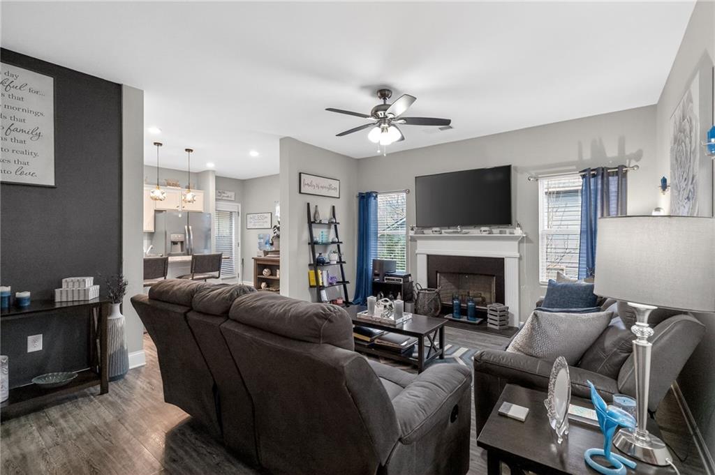 353 Daffodil Drive Temple, GA 30179 - Photo 10 of 30 a living room with furniture a fireplace and a flat screen tv