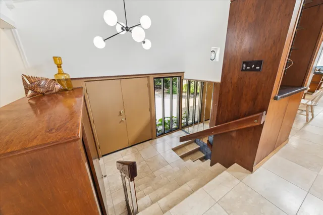 a view of staircase with a rug