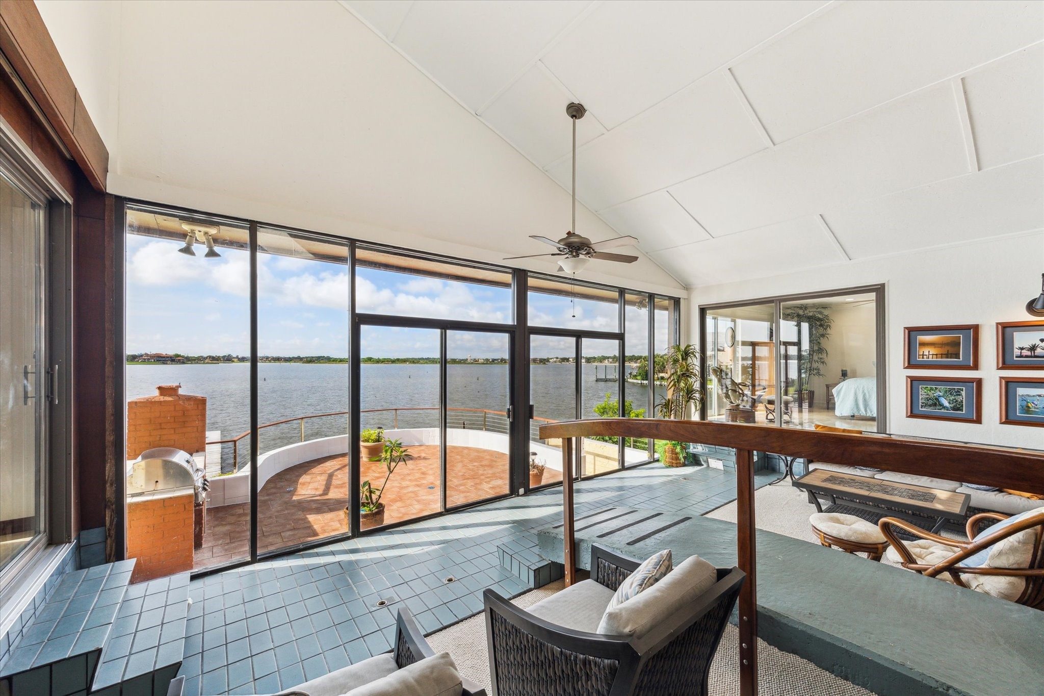 2414 Baycrest Drive Houston, TX 77058 - Photo 16 of 48 a view of a living room with furniture and floor to ceiling windows