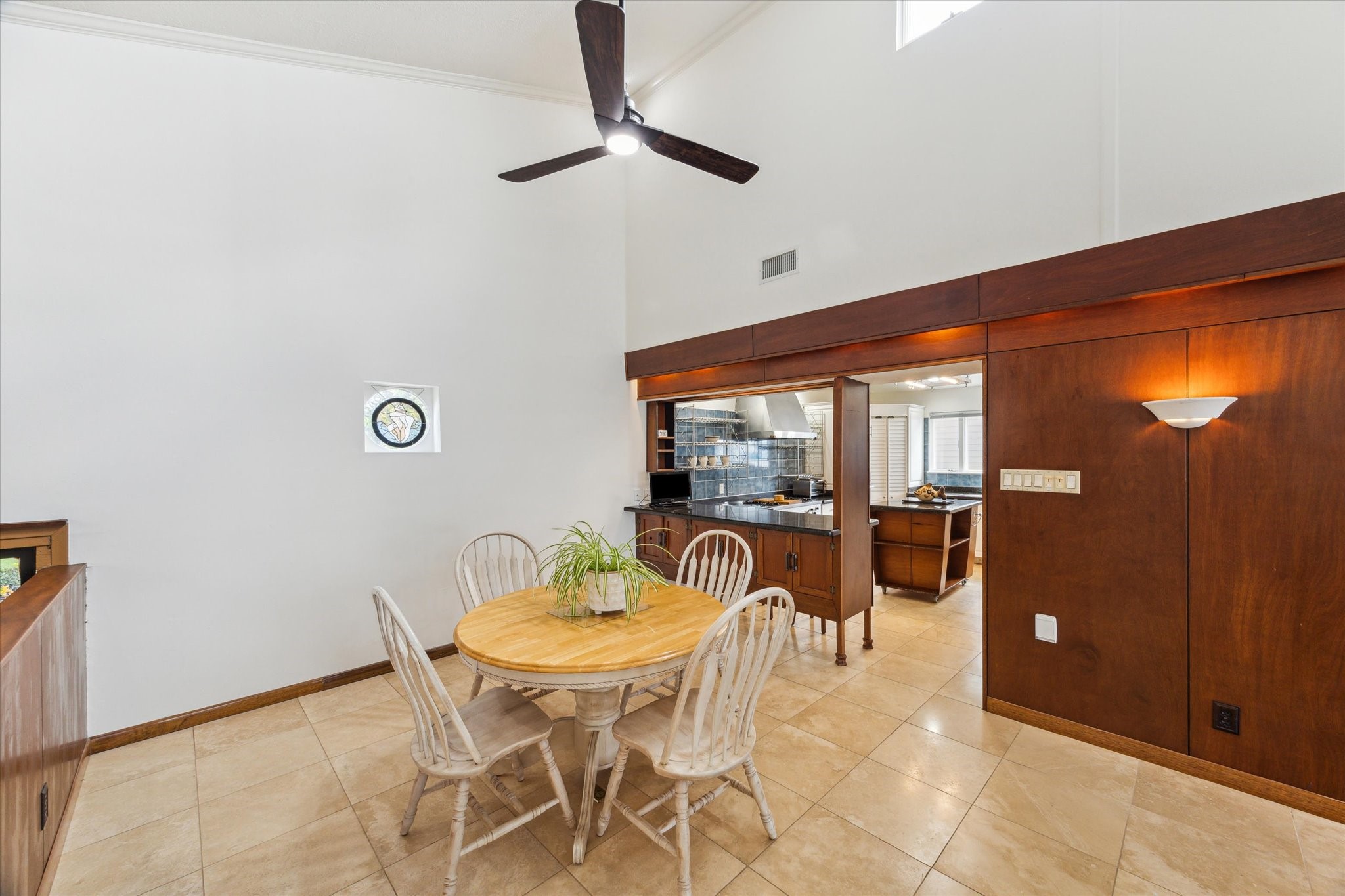 2414 Baycrest Drive Houston, TX 77058 - Photo 20 of 48 a dining room with furniture and a floor to ceiling window