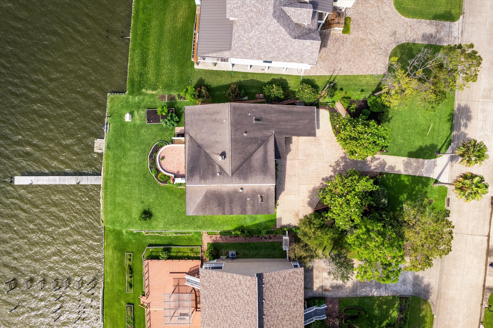 2414 Baycrest Drive Houston, TX 77058 - Photo 44 of 48 an aerial view of a house with a garden and lake view
