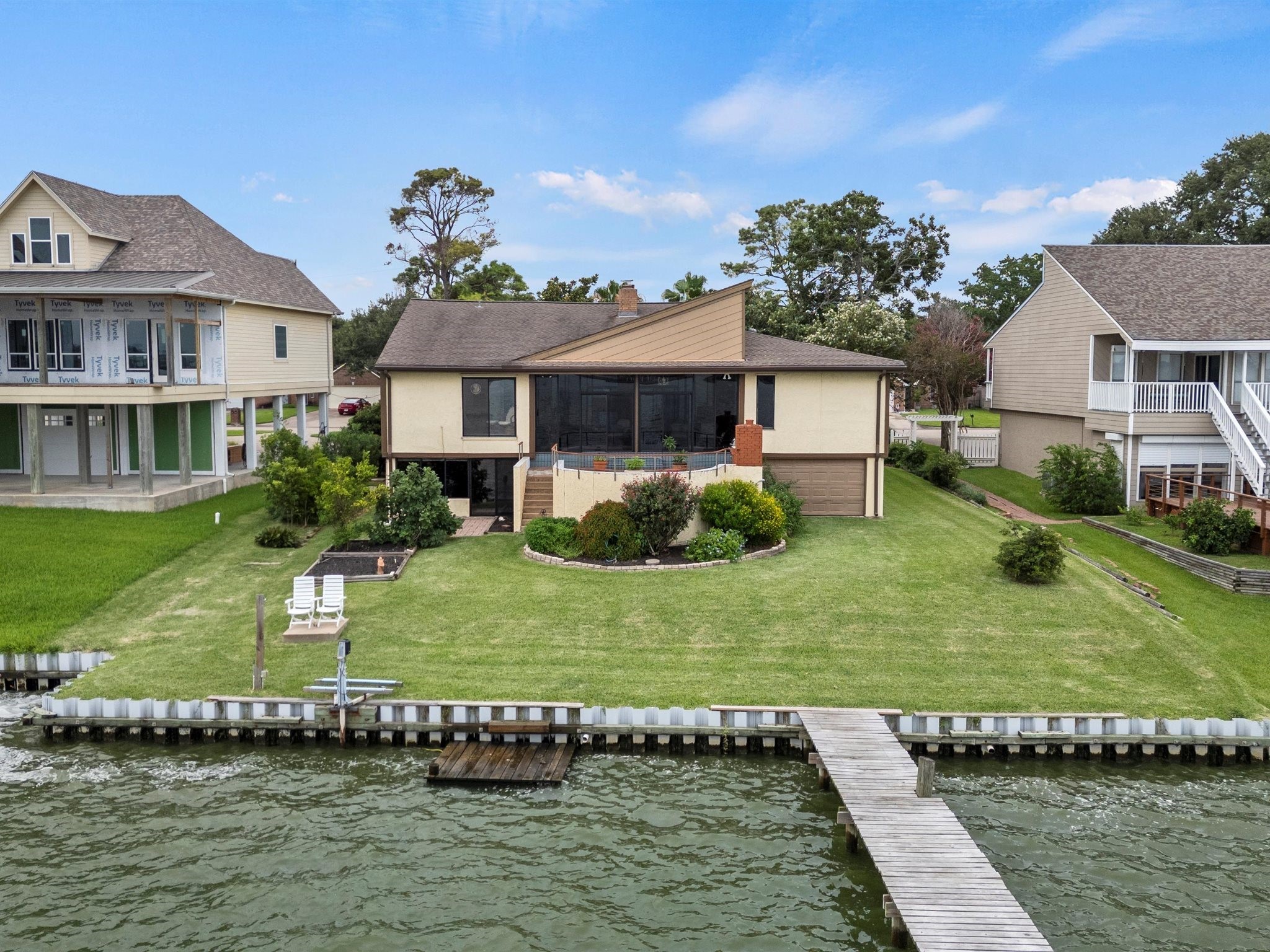 2414 Baycrest Drive Houston, TX 77058 - Photo 5 of 48 a front view of a house with a garden
