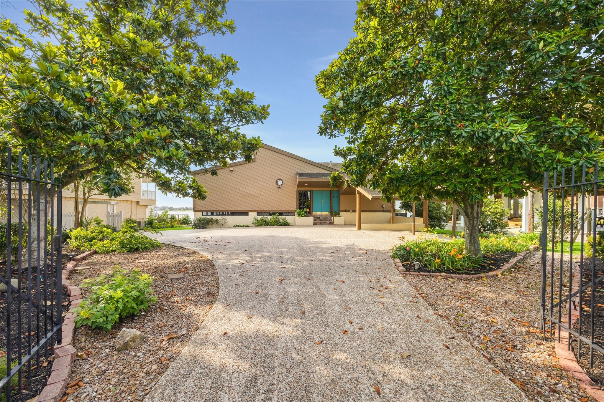 2414 Baycrest Drive Houston, TX 77058 - Photo 8 of 48 a view of a yard with plants and a fountain