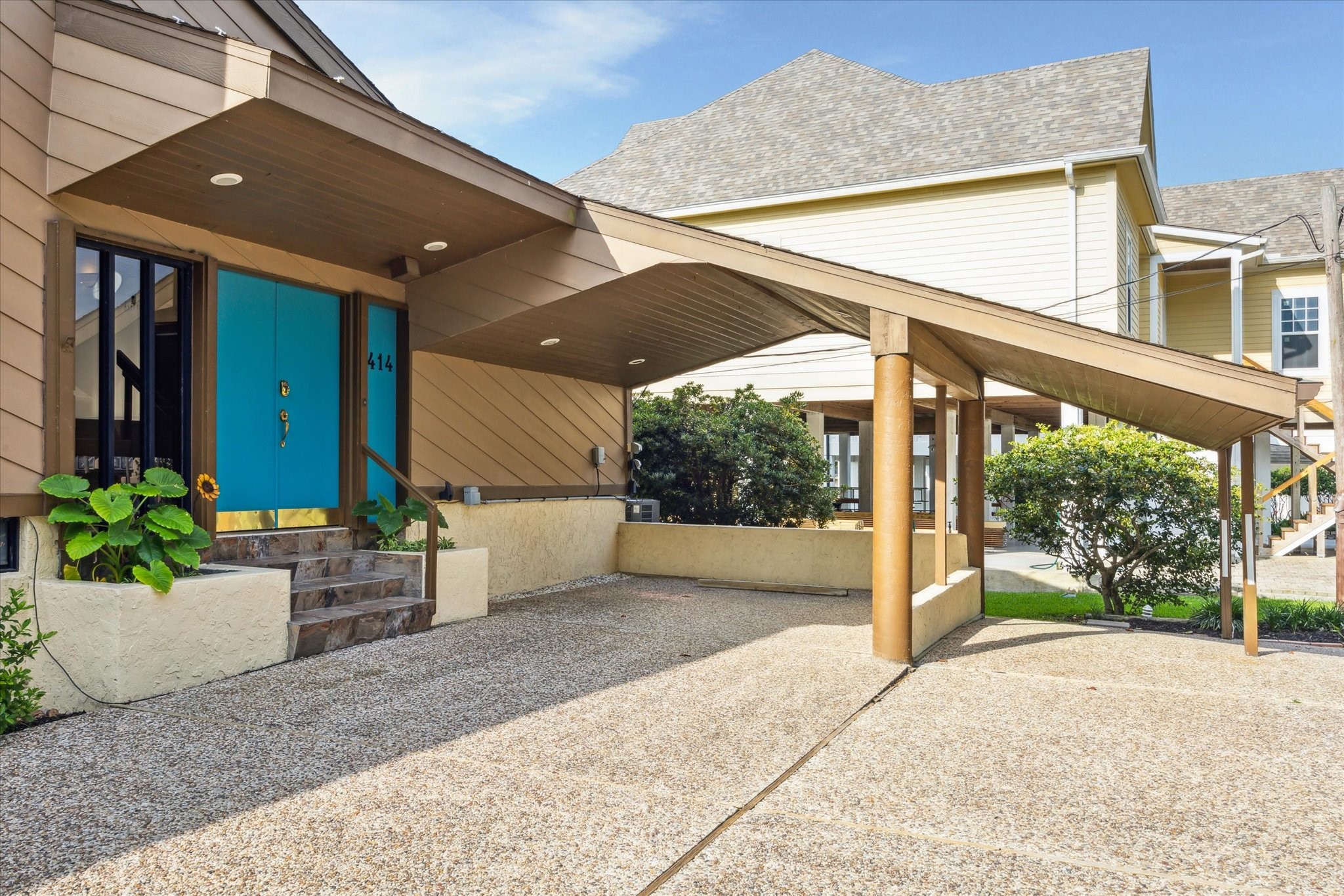2414 Baycrest Drive Houston, TX 77058 - Photo 10 of 48 a porch with a table and chairs and potted plants
