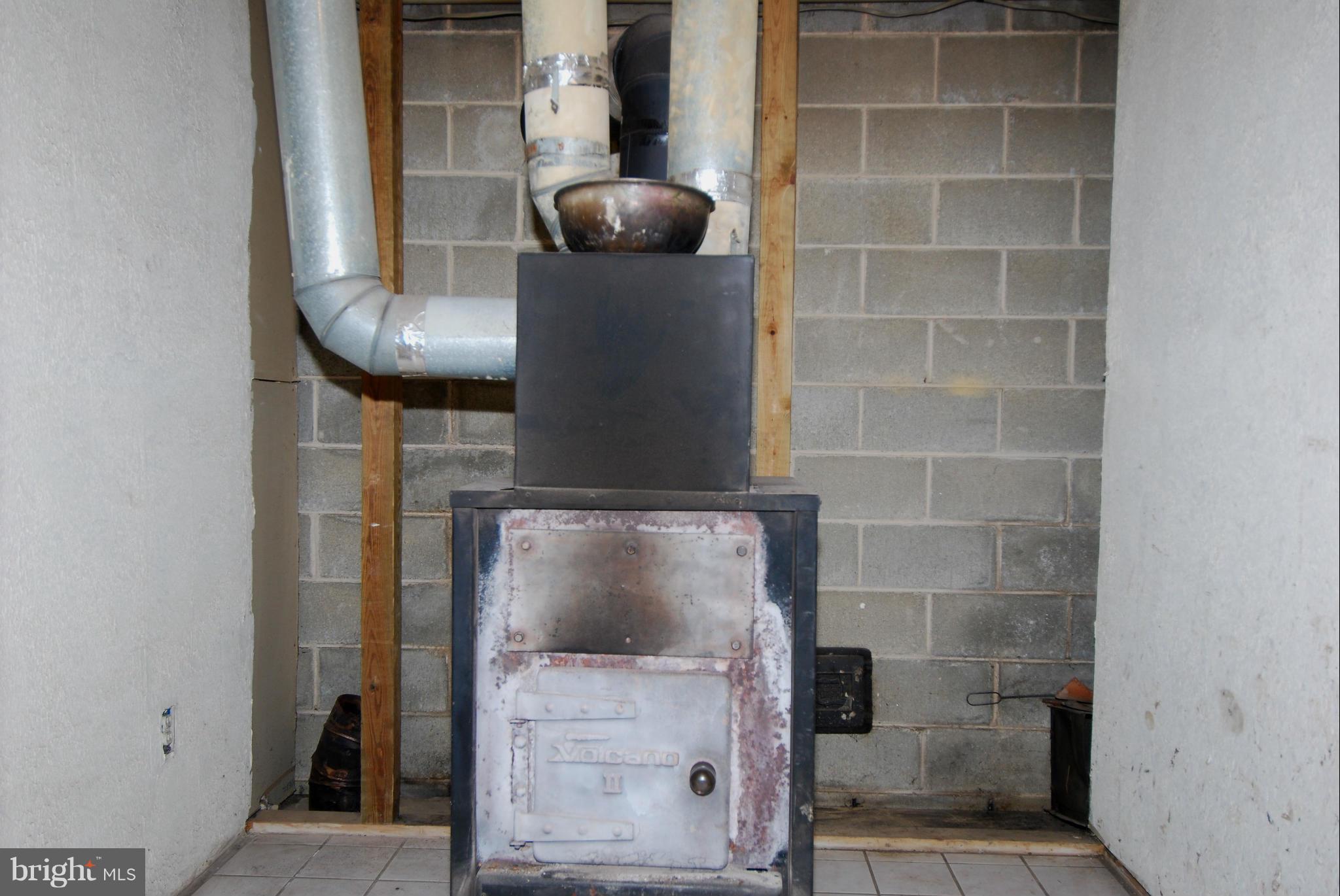 1865 Colora Road Colora, MD 21917 - Photo 23 of 30 "Volcano" Wood Stove duct to heat home