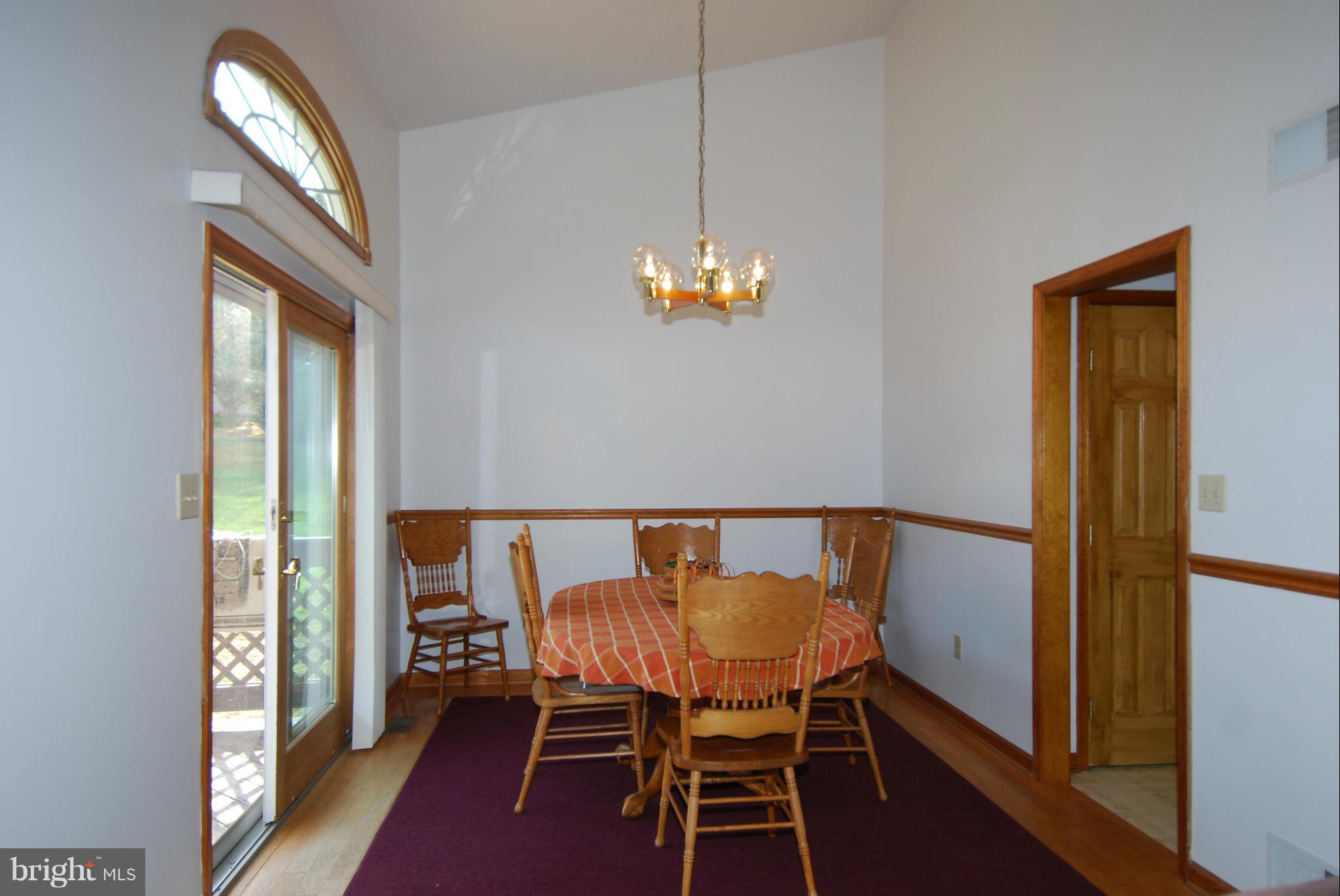 1865 Colora Road Colora, MD 21917 - Photo 10 of 30 Dining Room has sliders to deck- Wood Floors