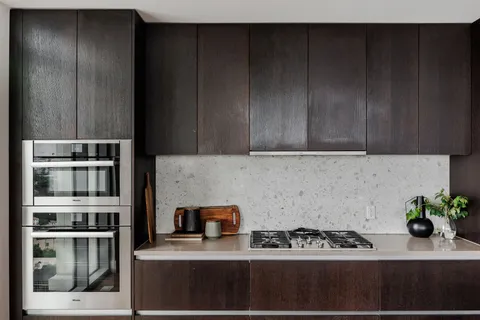 a kitchen with a cabinets and appliances