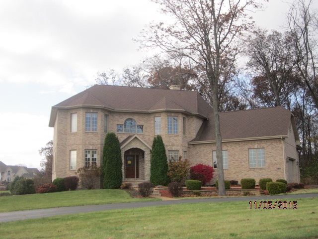 12680 Ashfield Road Caledonia, IL 61011 - Photo 1 of 24 a front view of a house with garden