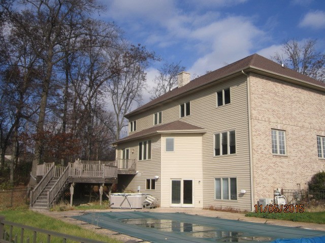 12680 Ashfield Road Caledonia, IL 61011 - Photo 3 of 24 a front view of a house with a yard