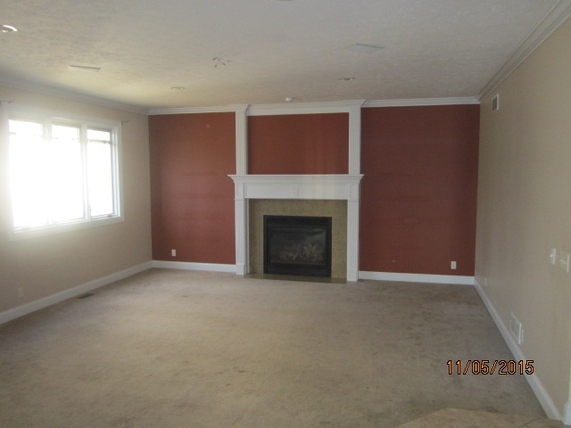 12680 Ashfield Road Caledonia, IL 61011 - Photo 10 of 24 a view of empty room with a fireplace