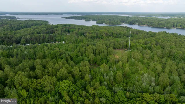 a view of a lake with green field