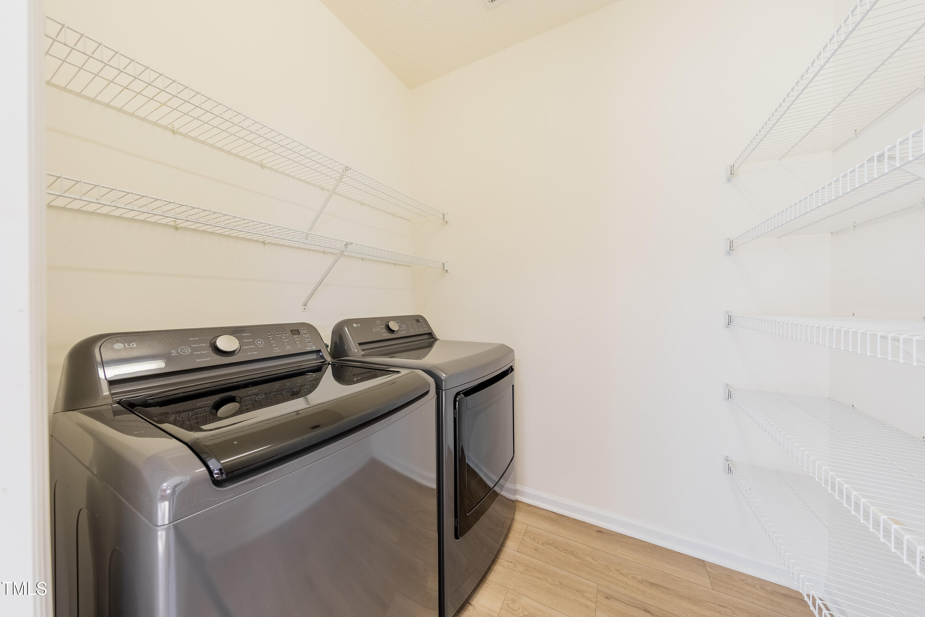 10809 Farmville Road Raleigh, NC 27614 - Photo 16 of 28 Laundry room offers extra storage as well