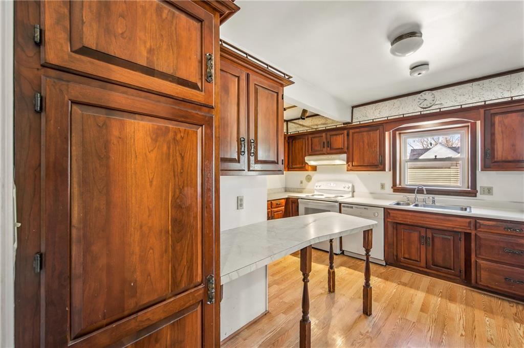 2341 South Hermitage Road Hermitage, PA 16148 - Photo 20 of 28 a kitchen with stainless steel appliances granite countertop wooden cabinets a dining table and chairs