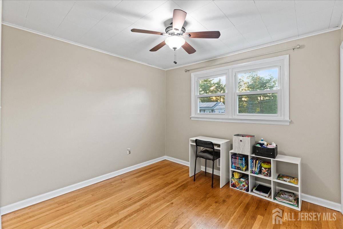 45 Lumar Road Lawrence Township, NJ 08648 - Photo 17 of 29 a view of a workspace with furniture and a window