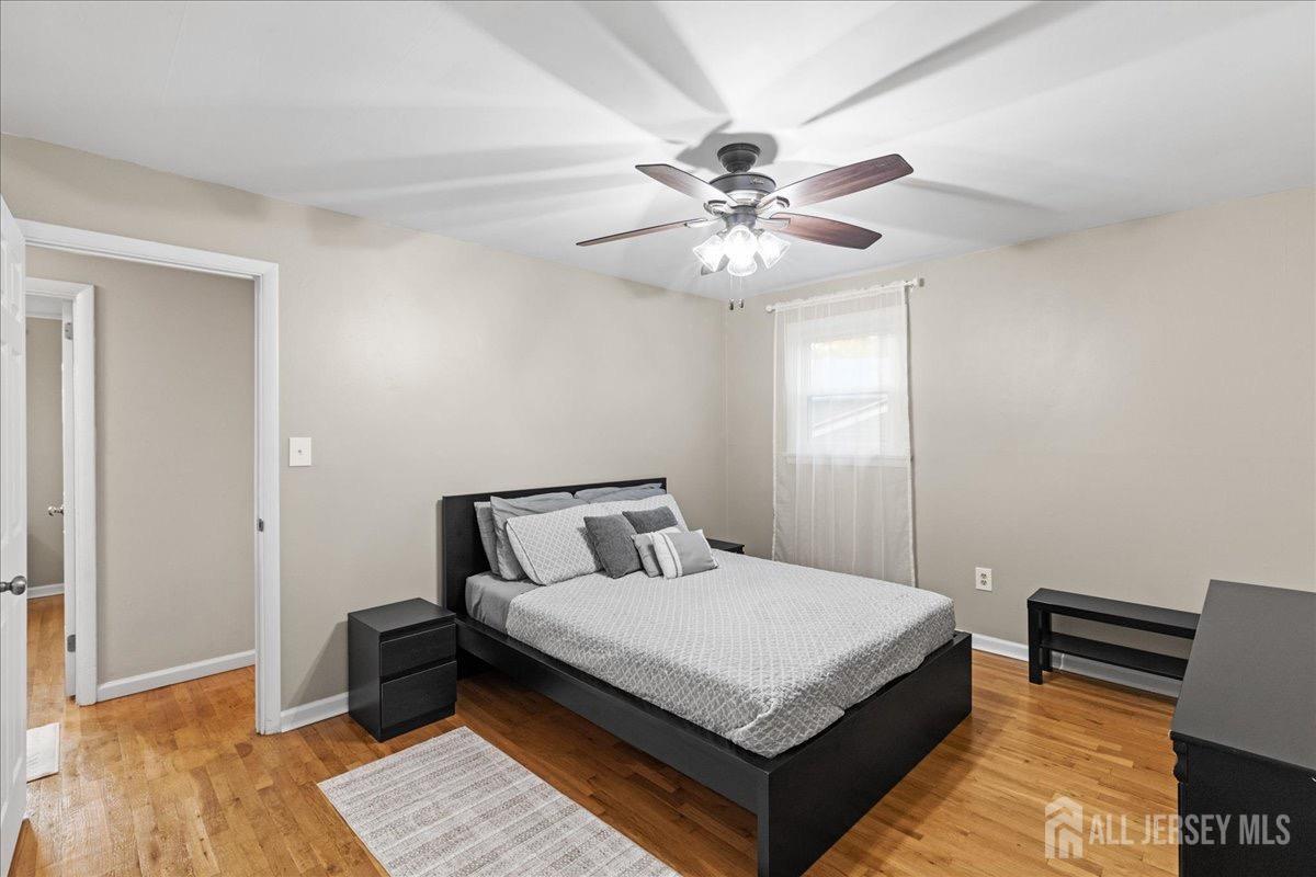 45 Lumar Road Lawrence Township, NJ 08648 - Photo 23 of 29 a bedroom with a bed and a chandelier