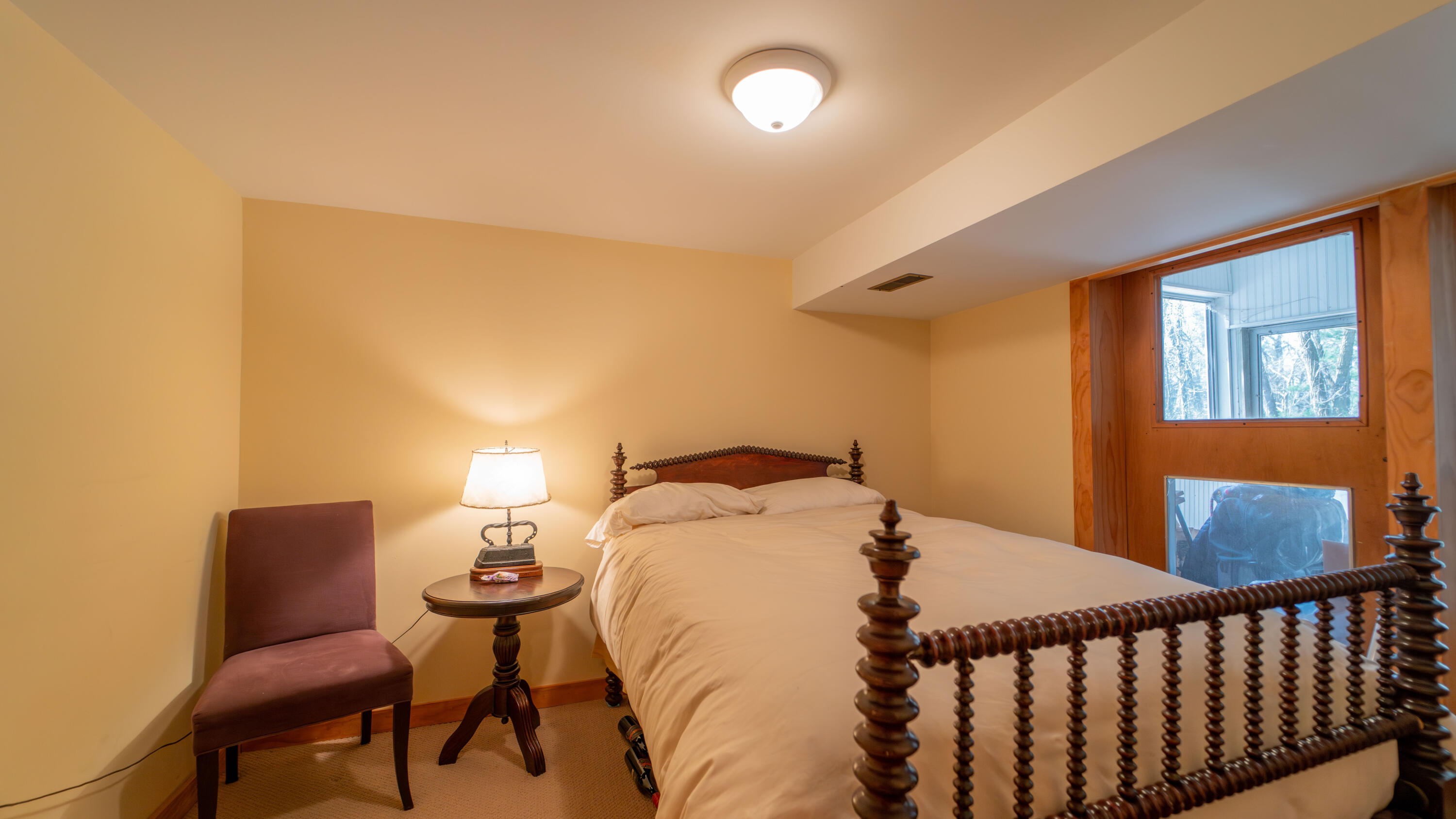 21 Turret Road Ogden Dunes, IN 46368 - Photo 27 of 32 a bedroom with a bed and window
