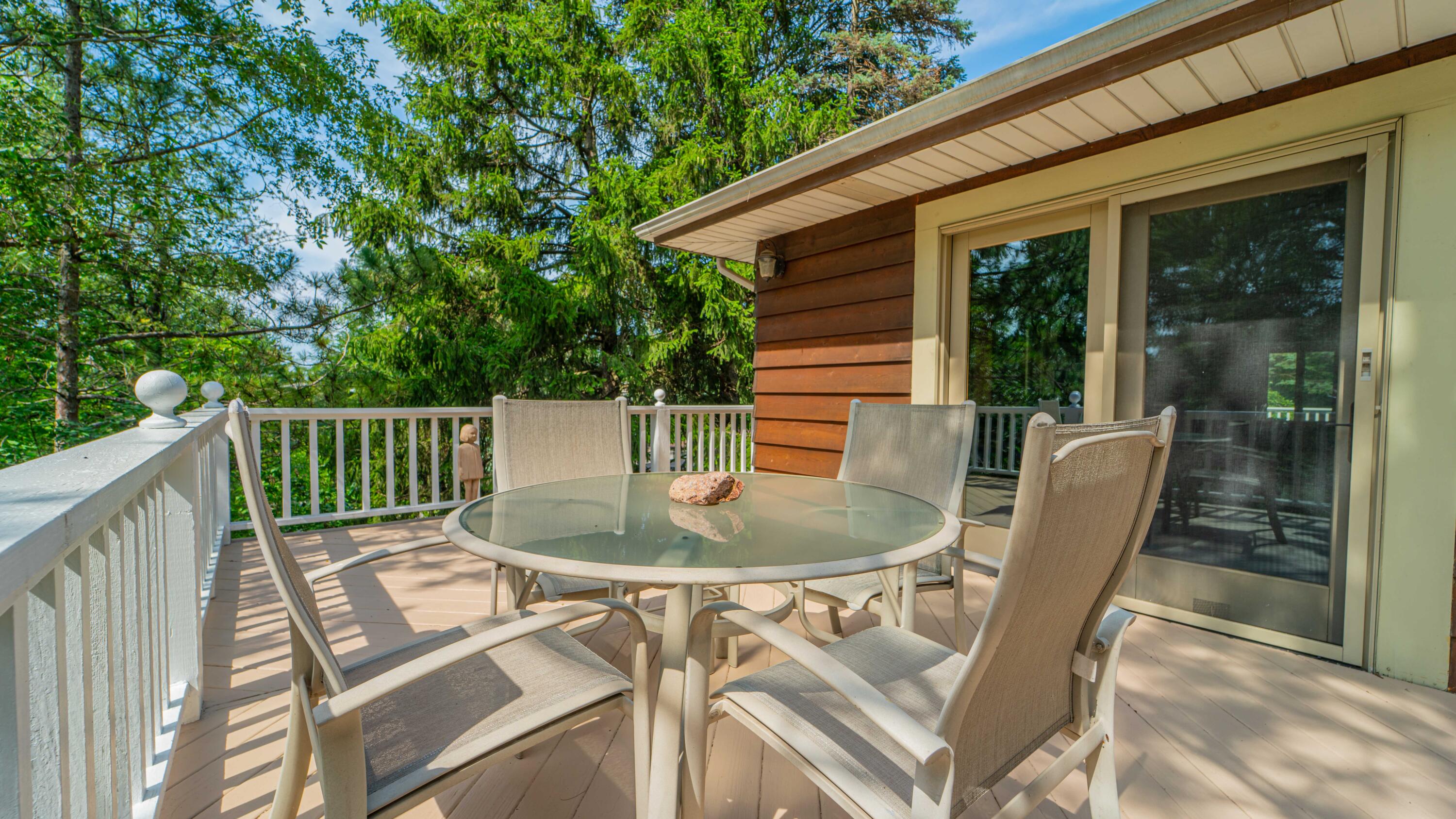 21 Turret Road Ogden Dunes, IN 46368 - Photo 4 of 32 a balcony with table and chairs