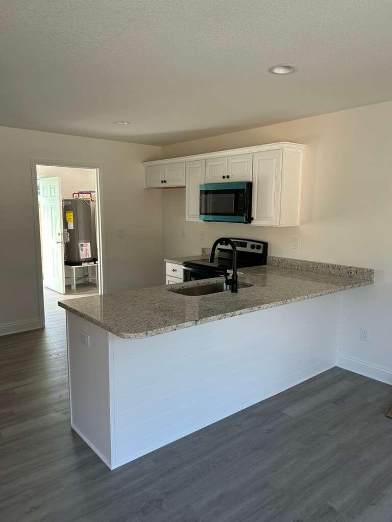 32 Constitution Avenue, Unit AB DeFuniak Springs, FL 32433 - Photo 3 of 12 IMG_5395