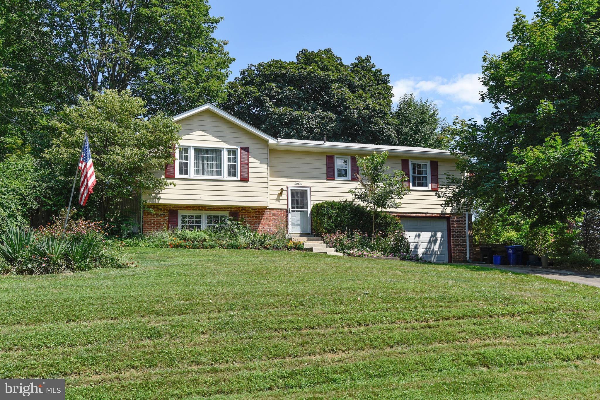 20601 Top Ridge Drive Boyds, MD 20841 - Photo 1 of 26 a front view of a house with a yard