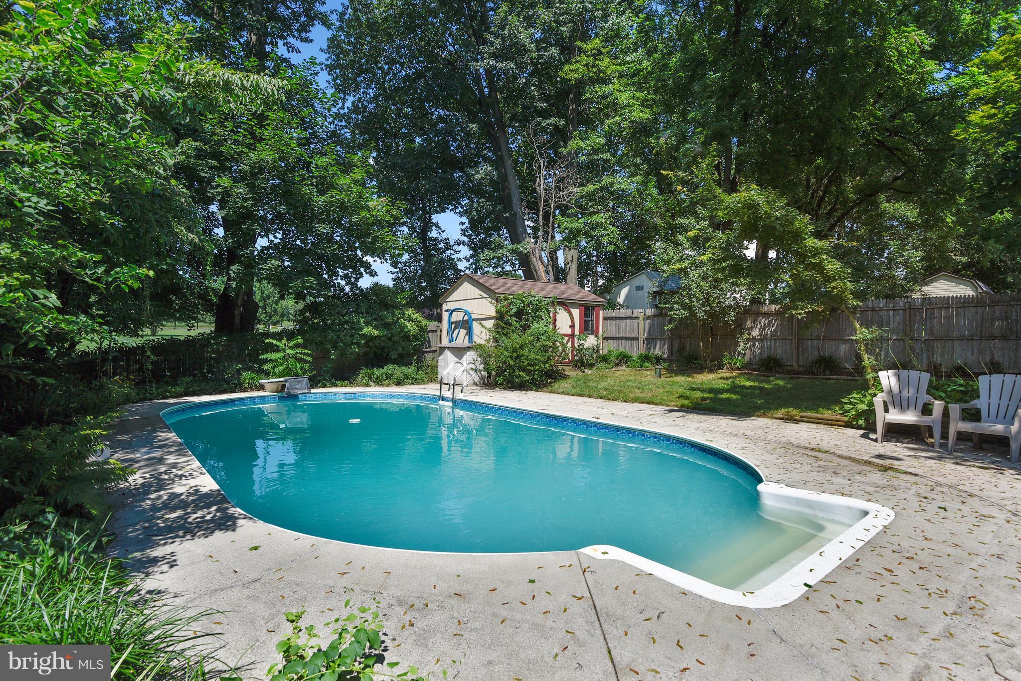 20601 Top Ridge Drive Boyds, MD 20841 - Photo 2 of 26 a view of a swimming pool with a patio