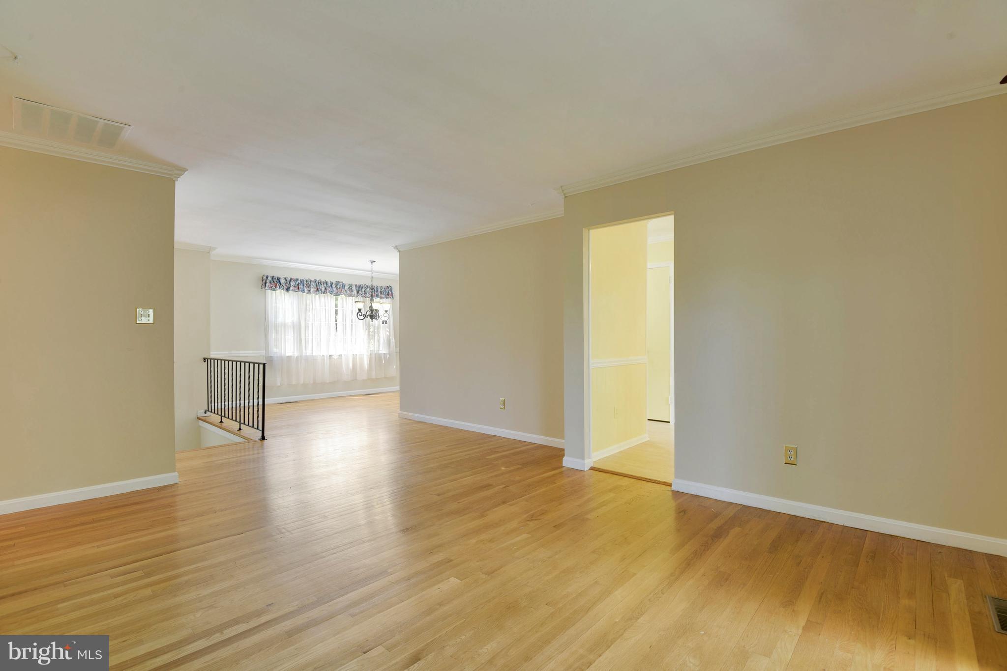 20601 Top Ridge Drive Boyds, MD 20841 - Photo 13 of 26 an empty room with wooden floor and windows