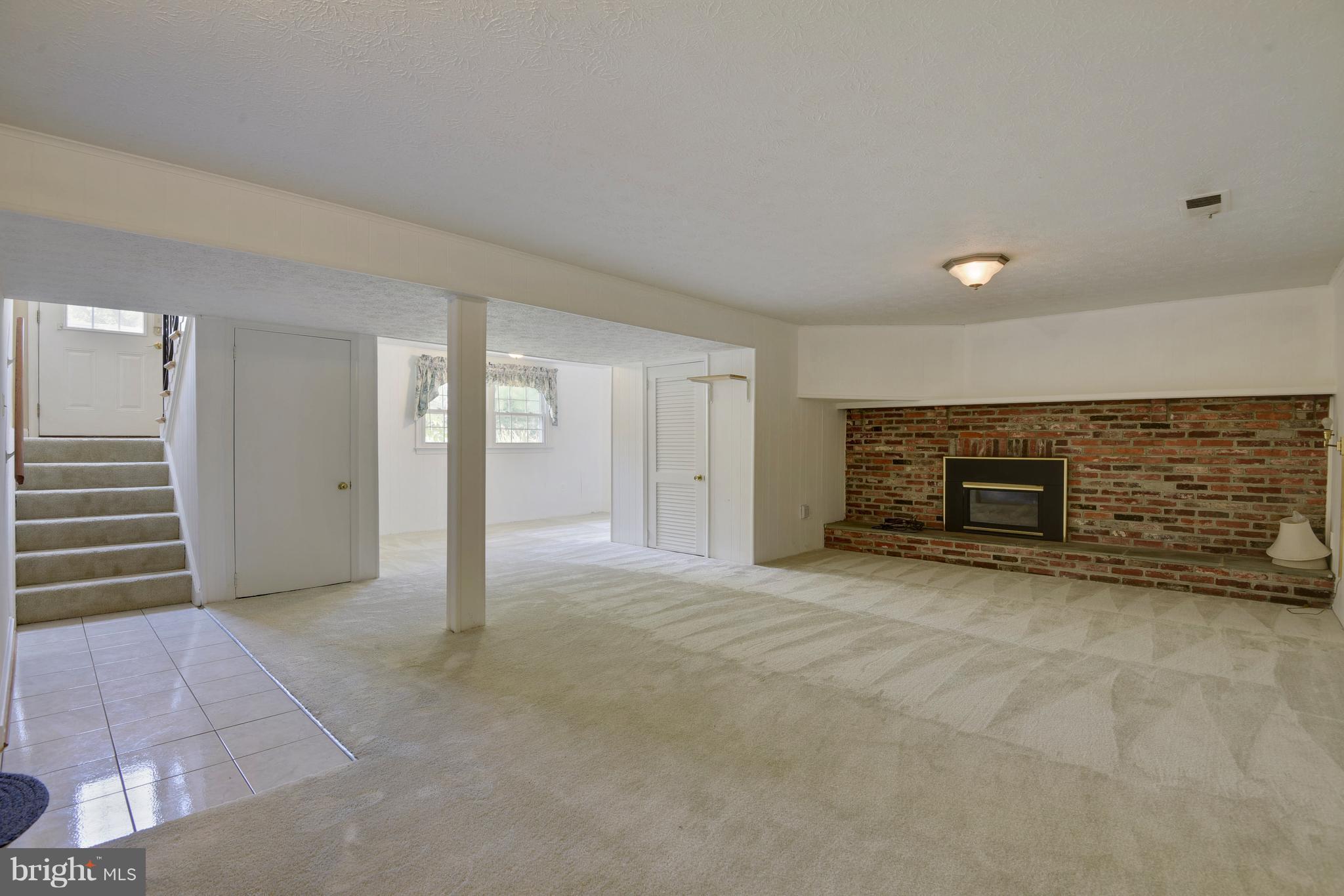 20601 Top Ridge Drive Boyds, MD 20841 - Photo 18 of 26 a view of an empty room with a fireplace
