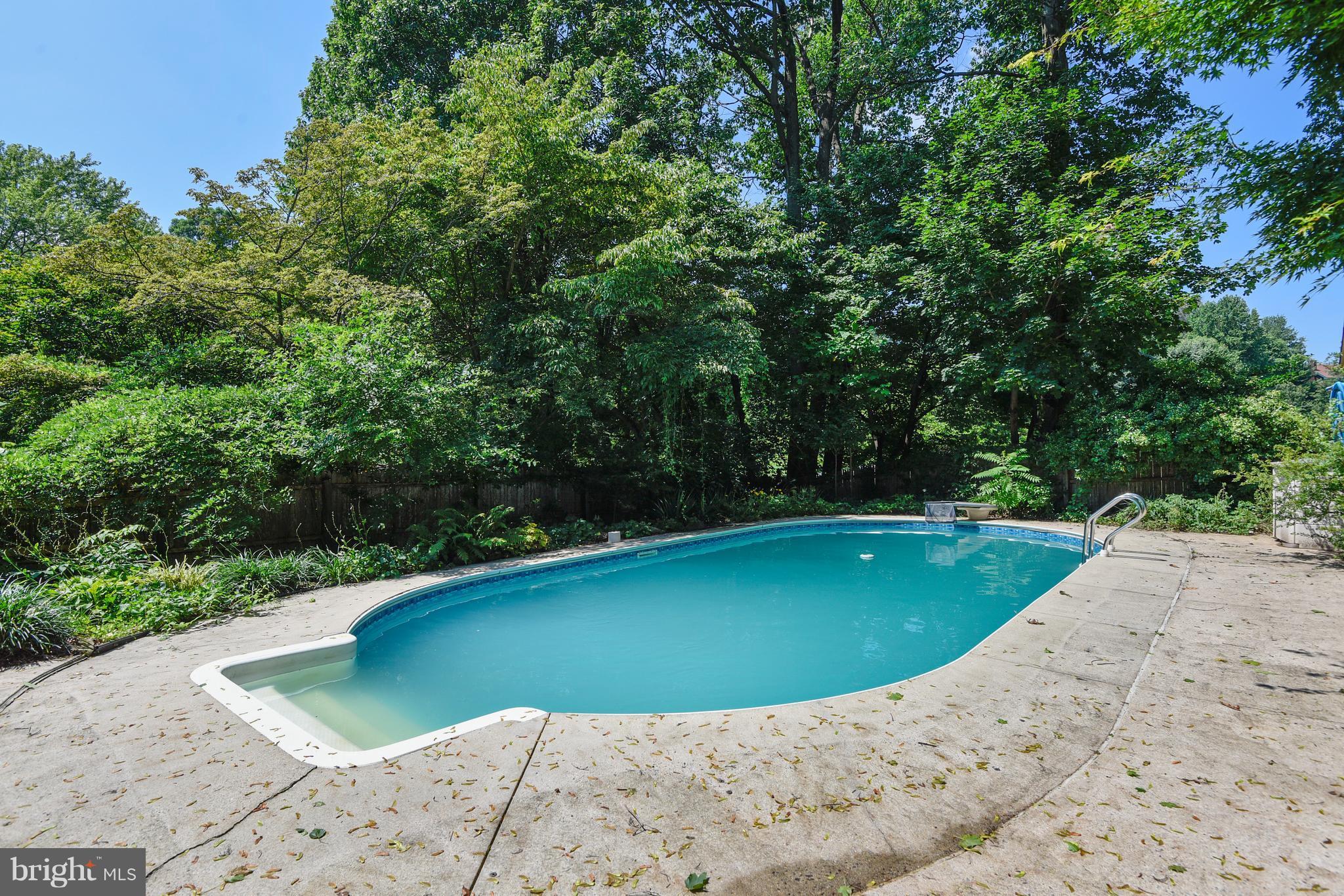 20601 Top Ridge Drive Boyds, MD 20841 - Photo 21 of 26 a view of a swimming pool with a yard