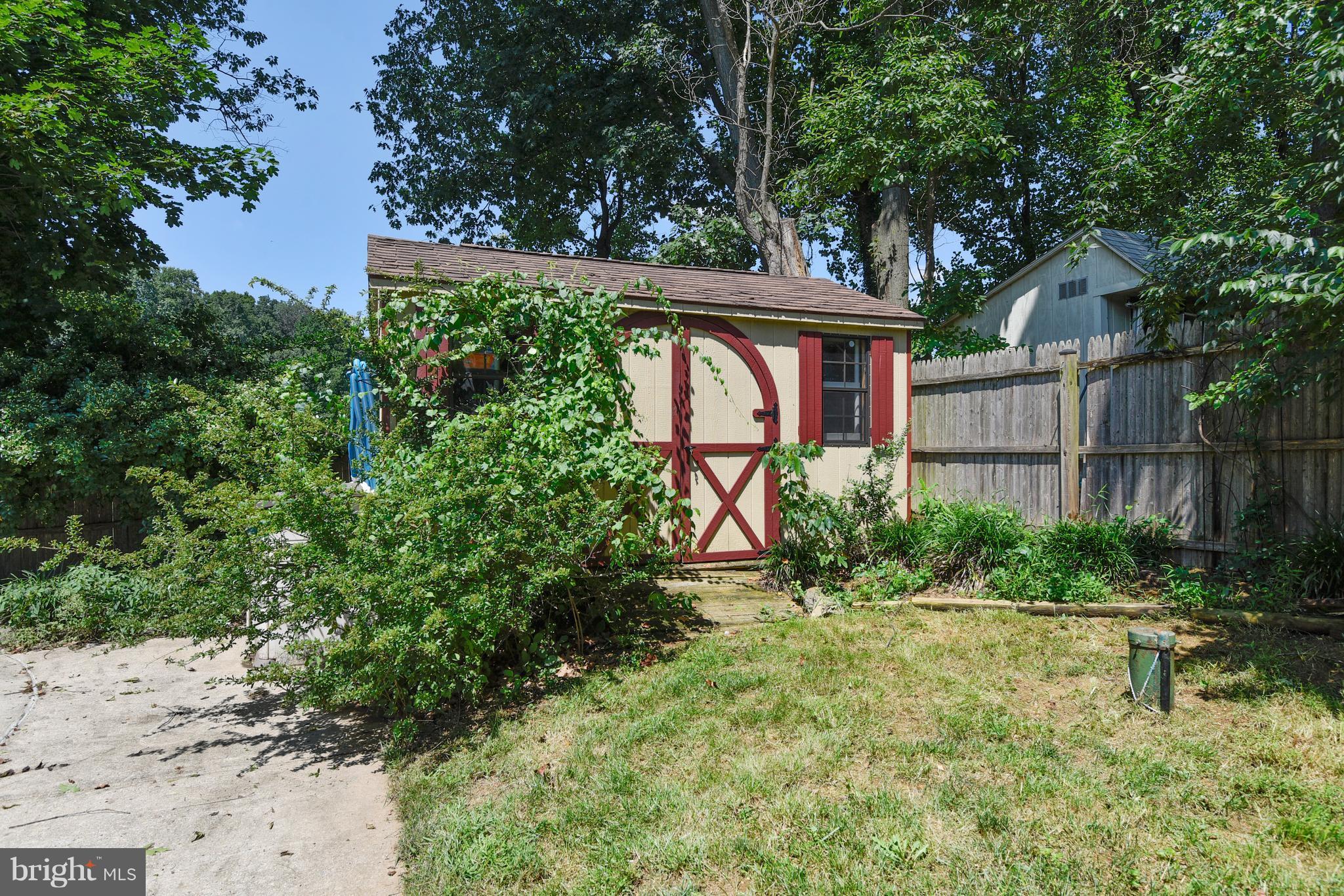20601 Top Ridge Drive Boyds, MD 20841 - Photo 23 of 26 a front view of a house with garden