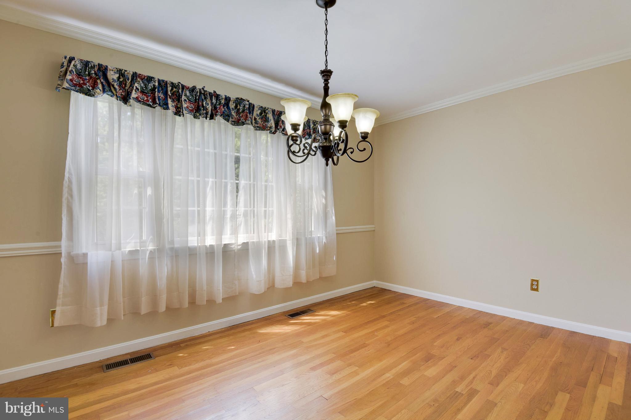 20601 Top Ridge Drive Boyds, MD 20841 - Photo 6 of 26 a view of a room with a window and wooden floor