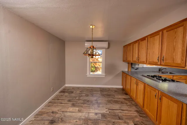 a kitchen that has a sink and a stove
