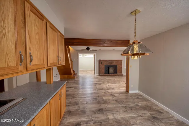 a view of a kitchen with a sink and a window