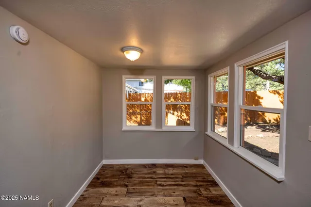 an empty room with windows