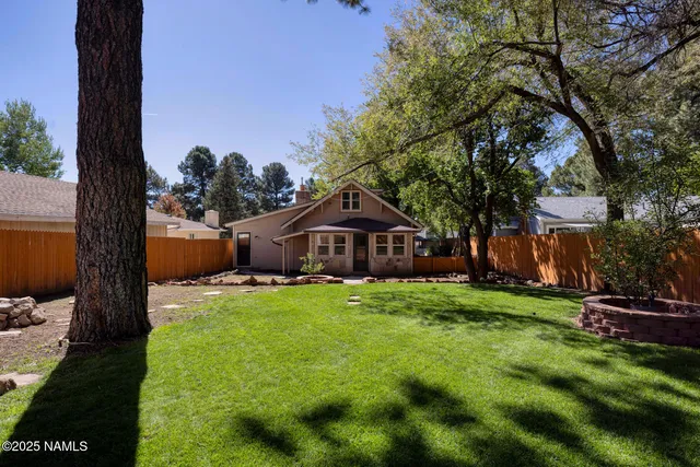 a backyard of a house with lots of green space