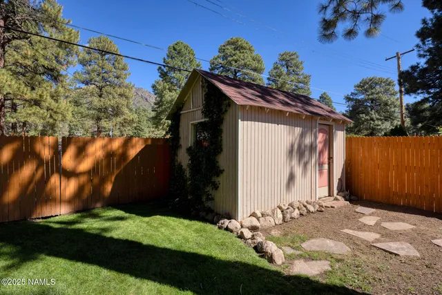 a view of a backyard with sitting area