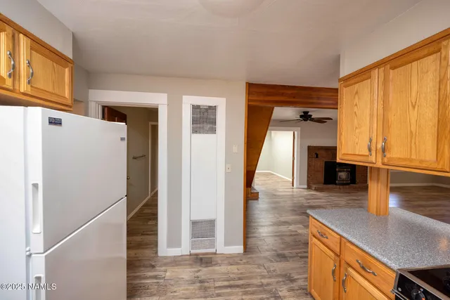 a view of a kitchen cabinets and a wooden floor