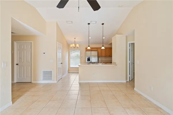 a view of a kitchen with a sink and a cabinet