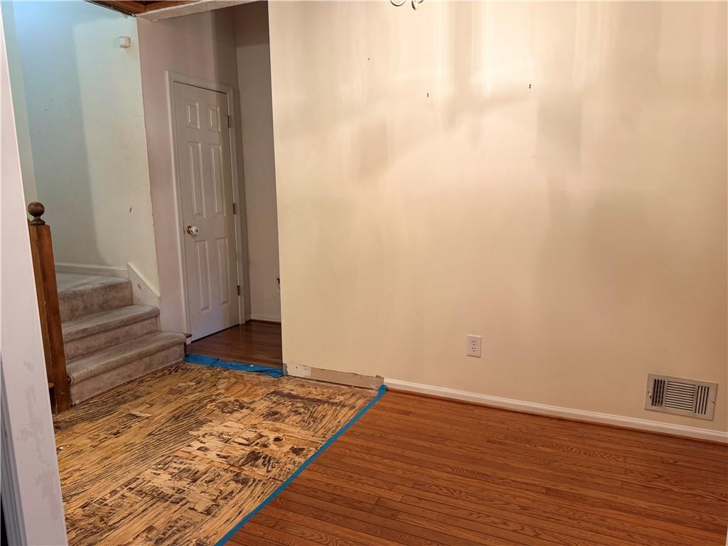 426 Pates Lake Court Hampton, GA 30228 - Photo 37 of 60 a view of a room with wooden floor and white walls
