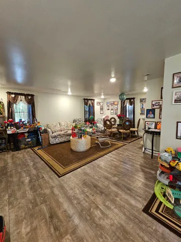 a living room with lots of furniture and a table