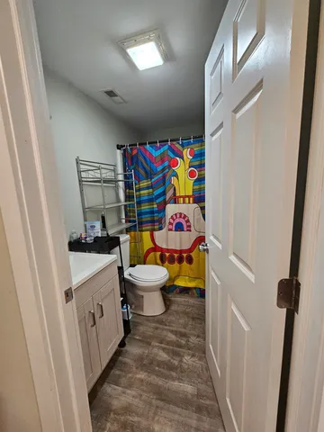 a room with baby crib furniture and a window