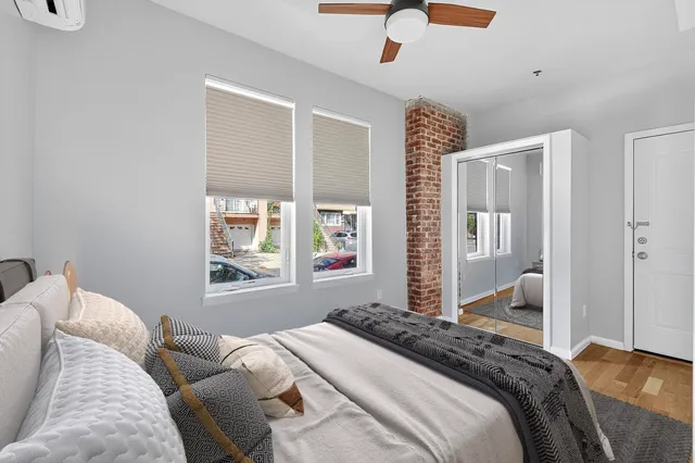 a bedroom with a large bed and a window