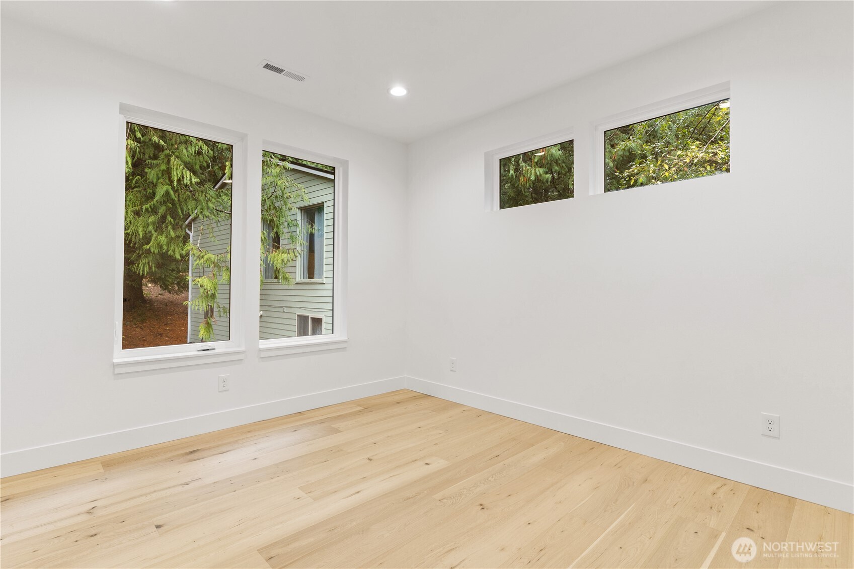 3 Acorn Place Bellingham, WA 98229 - Photo 20 of 35 a view of an empty room with wooden floor and a window