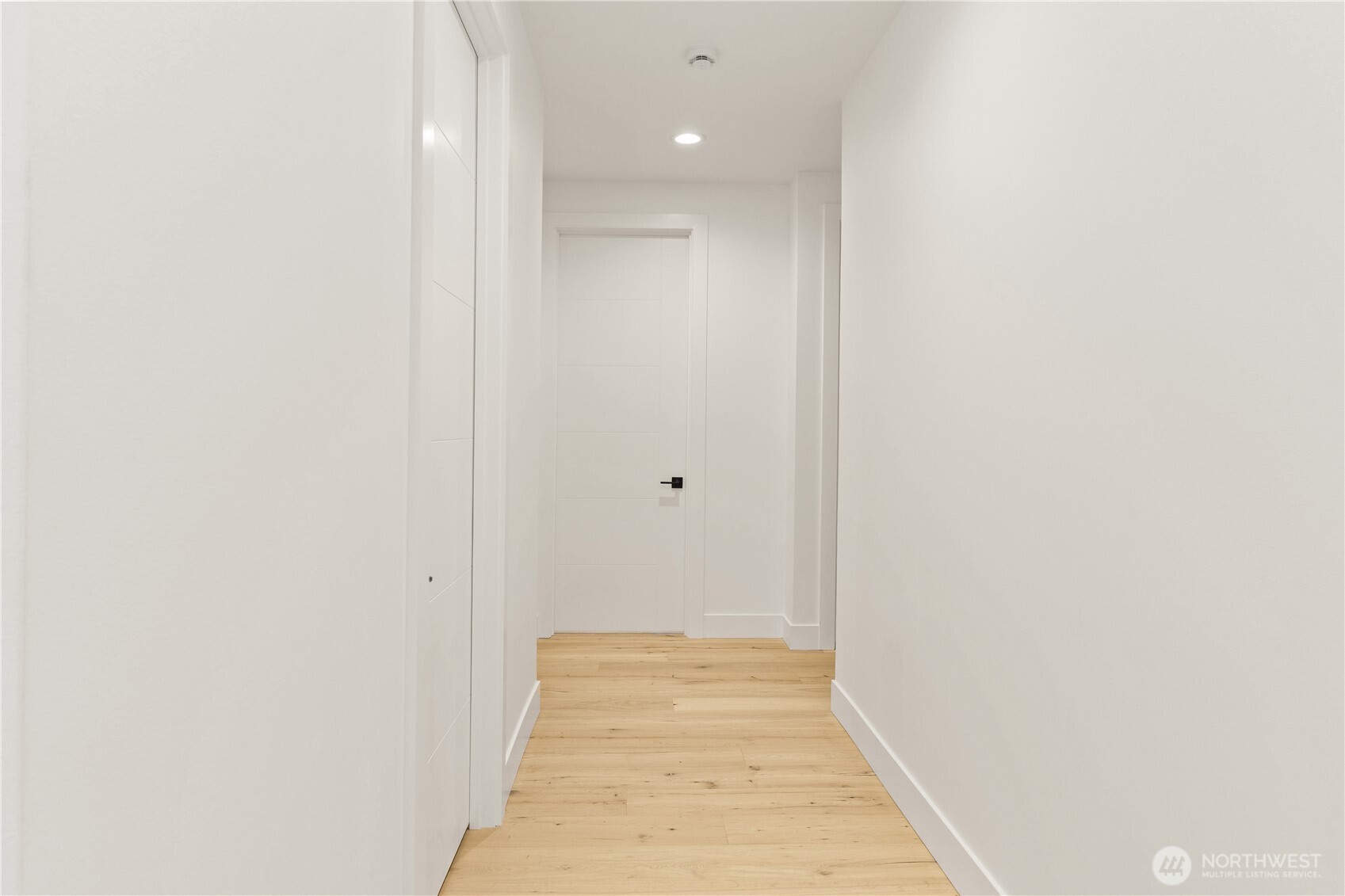 3 Acorn Place Bellingham, WA 98229 - Photo 25 of 35 a view of a hallway with wooden floor