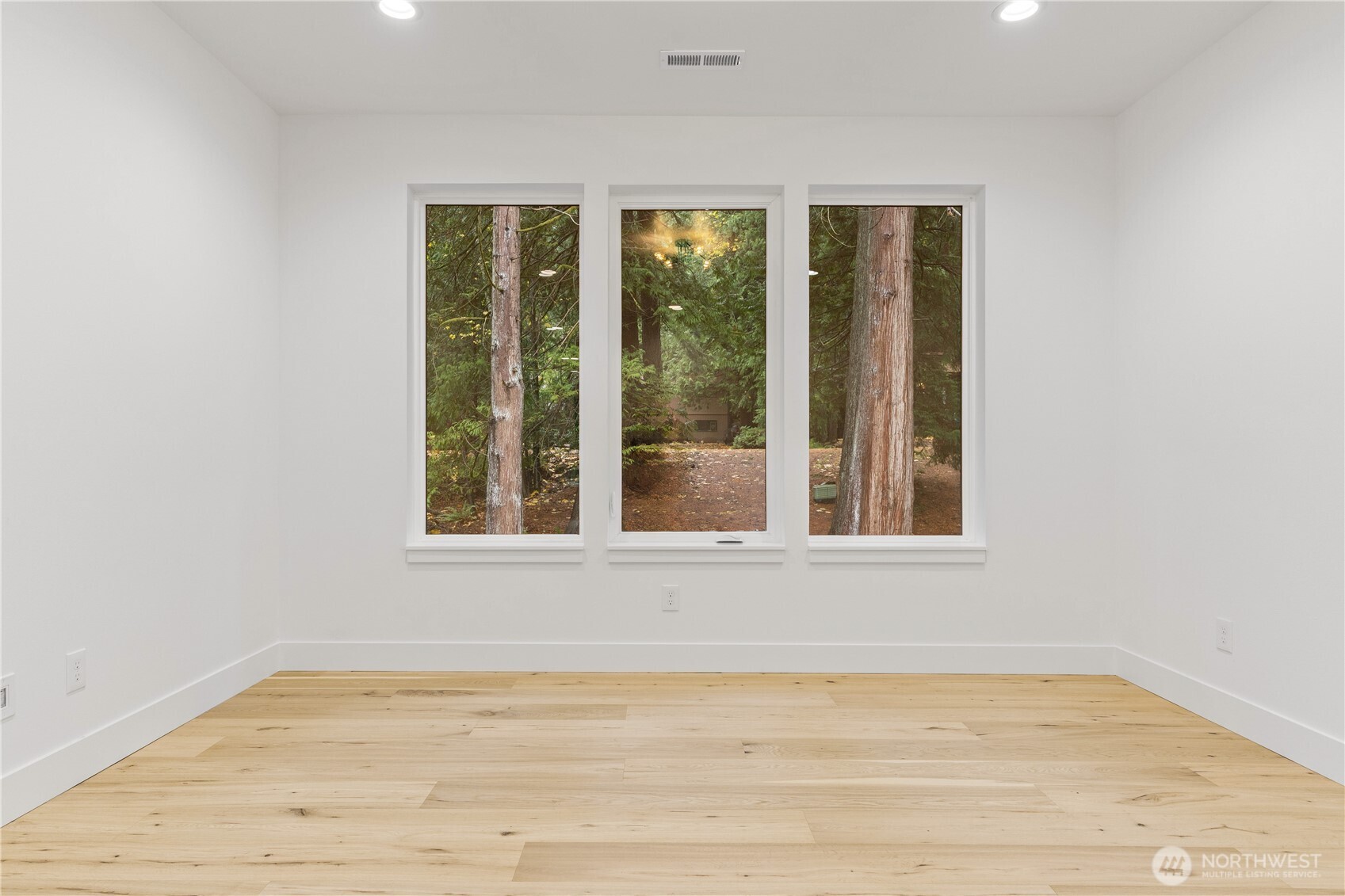 3 Acorn Place Bellingham, WA 98229 - Photo 27 of 35 a view of an empty room with wooden floor and a window
