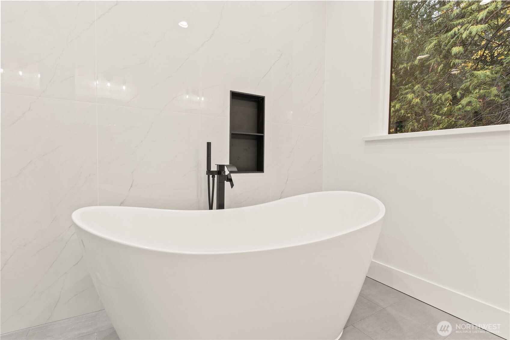 3 Acorn Place Bellingham, WA 98229 - Photo 31 of 35 a white bath tub sitting in a bathroom