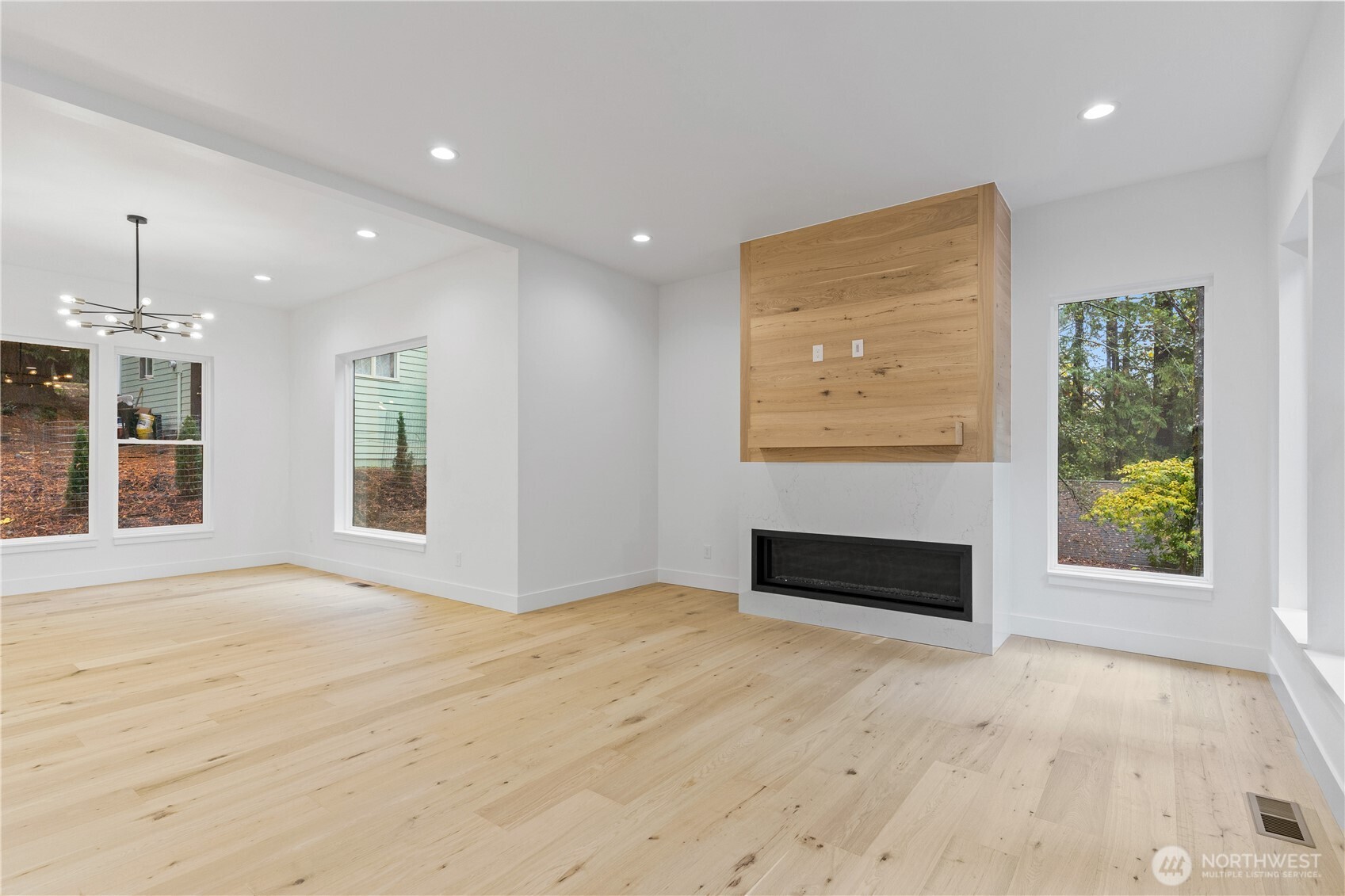 3 Acorn Place Bellingham, WA 98229 - Photo 5 of 35 an empty room with windows and fireplace