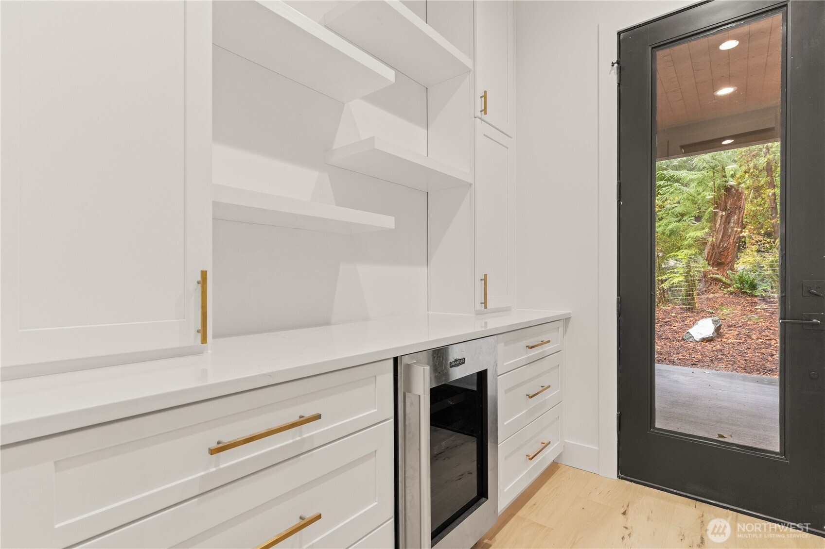 3 Acorn Place Bellingham, WA 98229 - Photo 9 of 35 a kitchen with white cabinets and white appliances