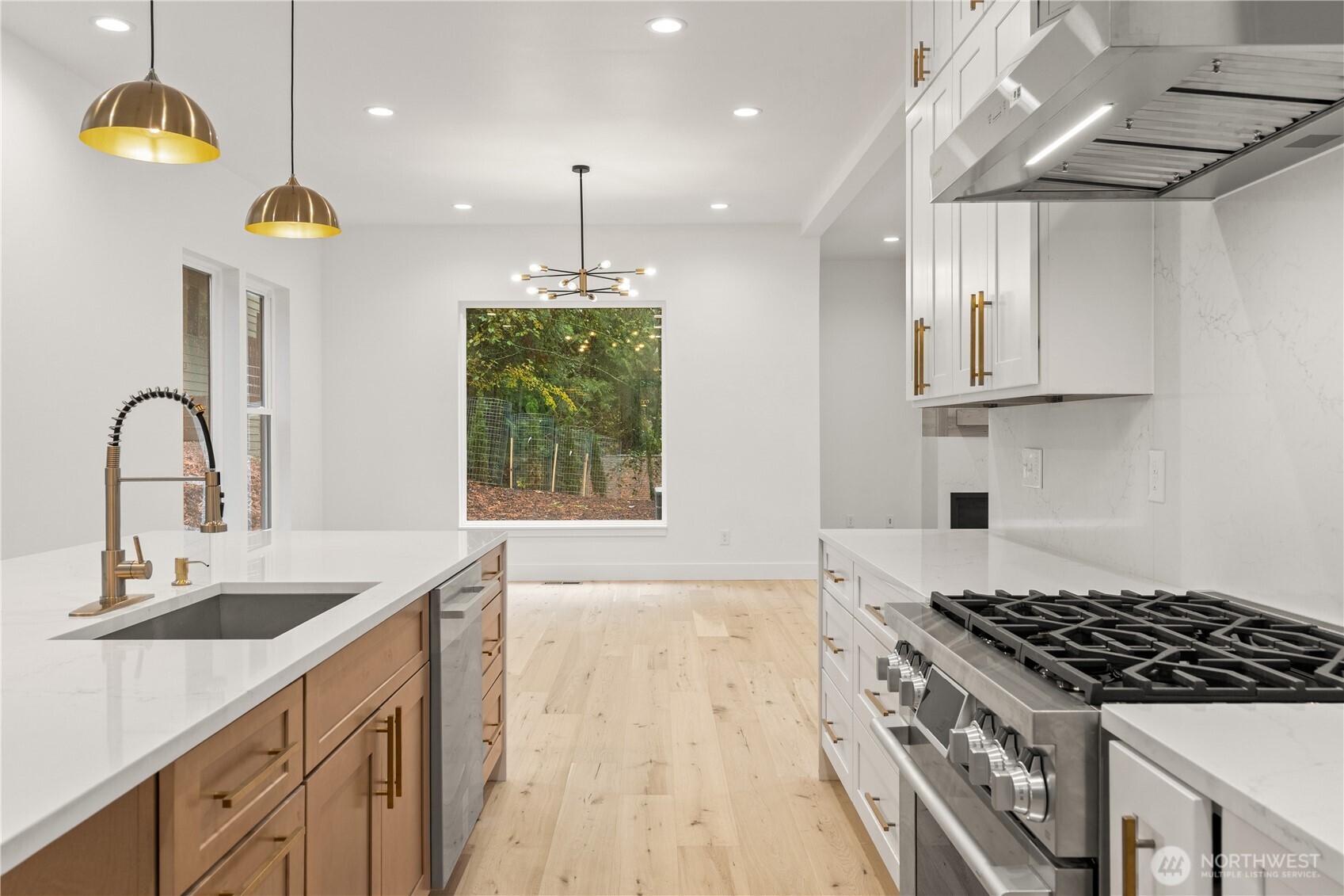 3 Acorn Place Bellingham, WA 98229 - Photo 10 of 35 a kitchen with kitchen island stainless steel appliances a sink a stove and a wooden floors