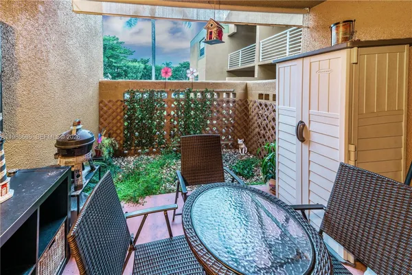 a view of balcony with furniture