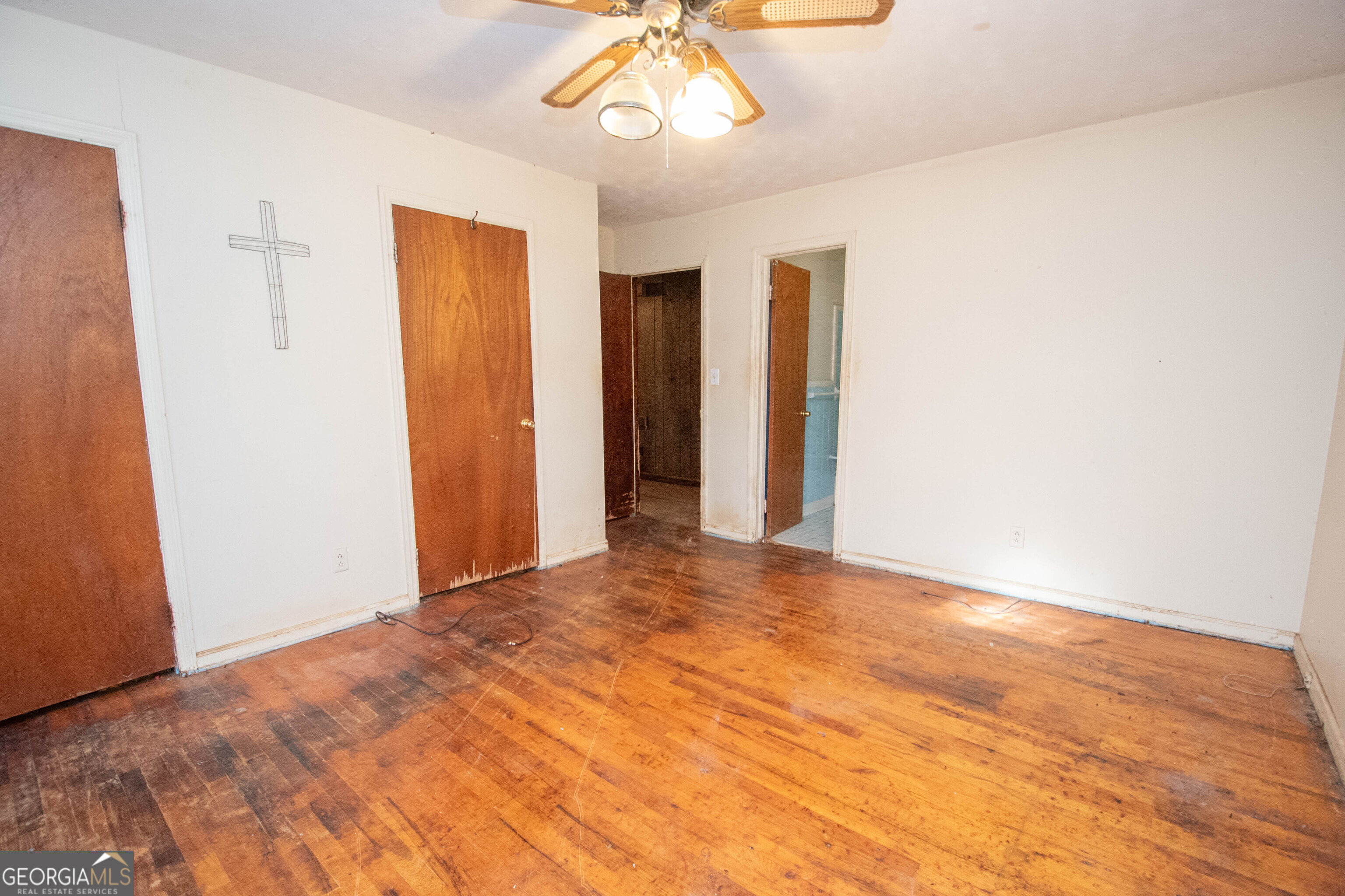 980 Grandma Branch Road Grantville, GA 30220 - Photo 12 of 33 a view of an empty room with wooden floor