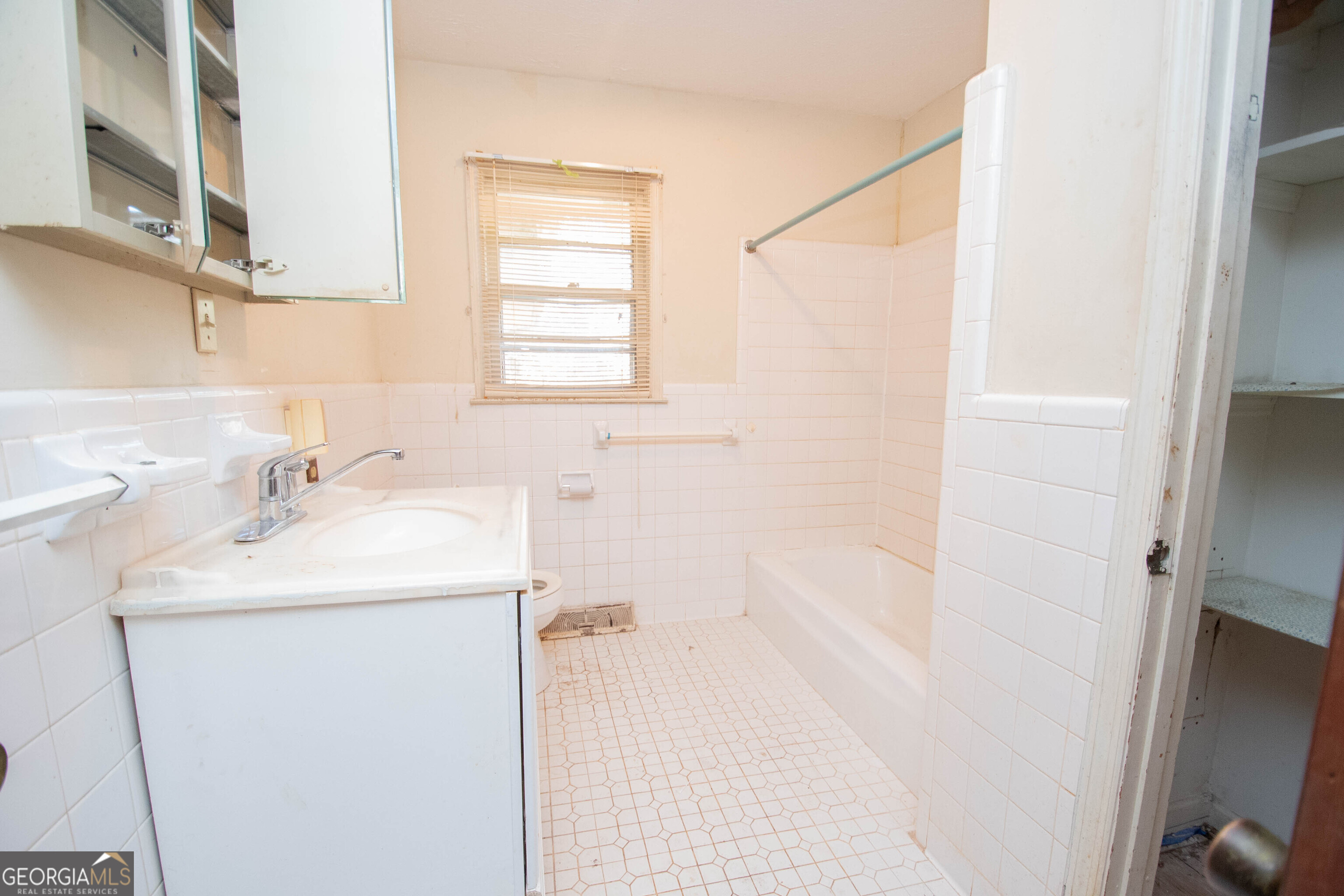 980 Grandma Branch Road Grantville, GA 30220 - Photo 18 of 33 a bathroom with a sink and a mirror
